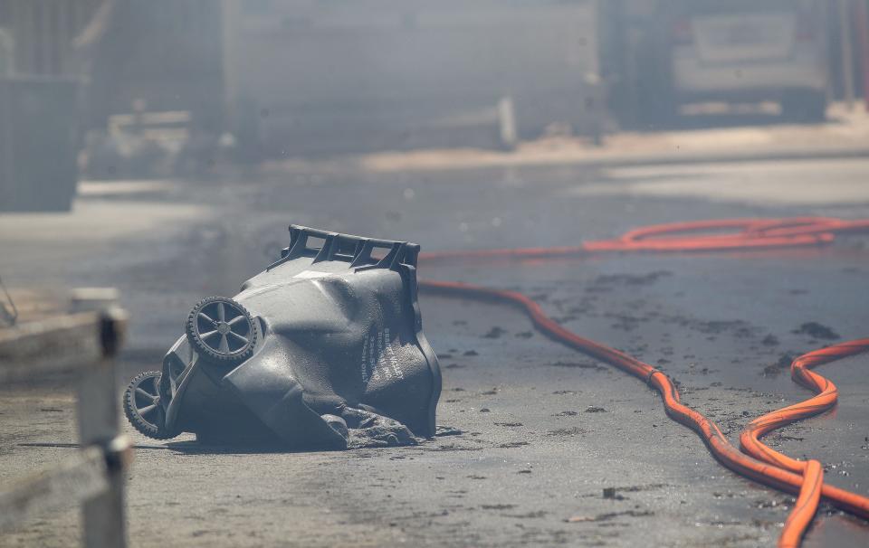 A nearby trash can was melted during a July 18 fire that destroyed mobile homes at the Country Squire RV and Mobile Home Park in Desert Hot Springs.