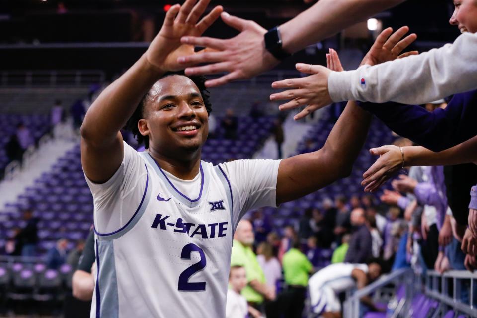Kansas State guard Tylor Perry (2) celebrates with fans after the Wildcats' 88-78 overtime victory against Oral Roberts on Tuesday night at Bramlage Coliseum.