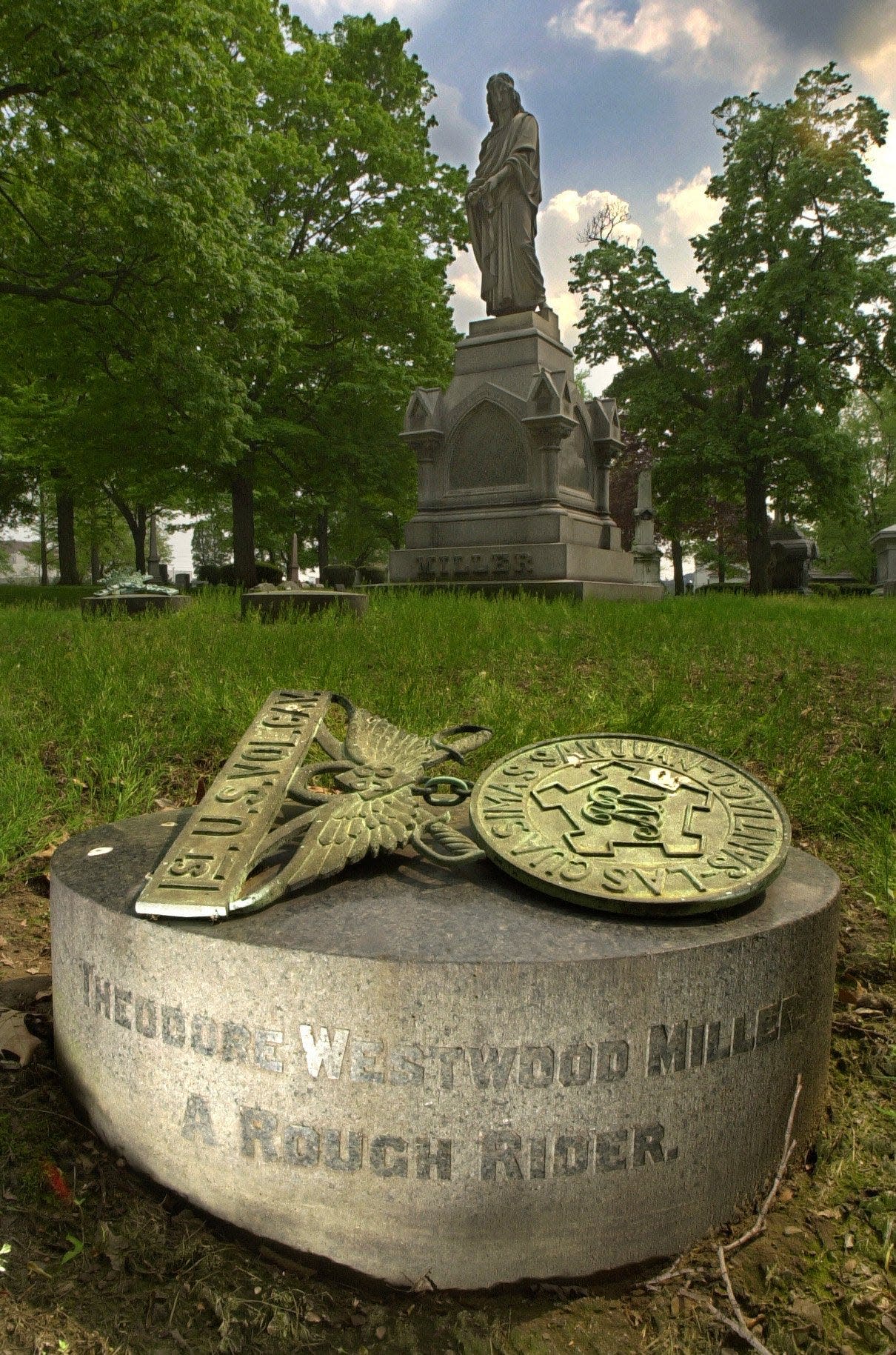 Someone has taken the bronze ornament from the Glendale Cemetery grave of Spanish-American War soldier Theodore Westwood Miller, a Rough Rider from Akron.