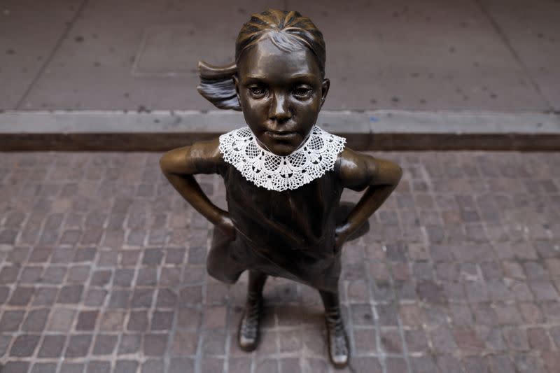 A jabot collar is seen placed on the Fearless Girl statue in honor of recently passed Associate Justice of the Supreme Court of the United States Ruth Bader Ginsburg in Manhattan, New York City