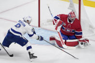 Montreal Canadiens goaltender Carey Price, right, makes a save against Tampa Bay Lightning centerTyler Johnson (9) during the second period of Game 4 of the NHL hockey Stanley Cup final in Montreal, Monday, July 5, 2021. (Paul Chiasson/The Canadian Press via AP)