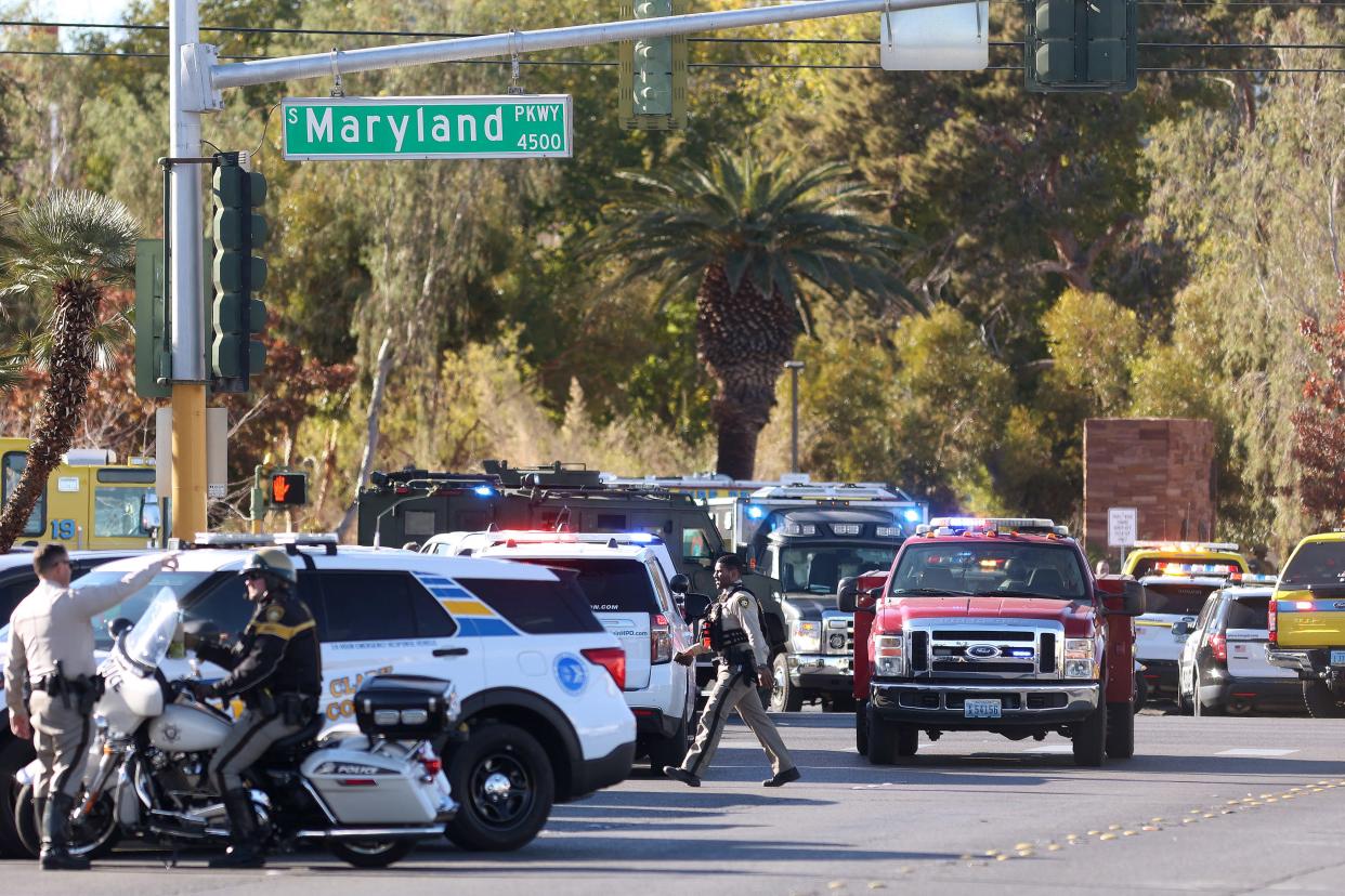 Emergency crews and law enforcement respond to a shooting at the University of Nevada, Las Vegas, campus on Dec. 6, 2023.