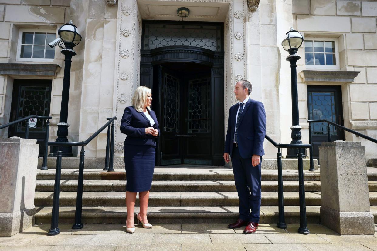 Paul Givan and Michelle O’Neill outside Parliament Buildings, Belfast, after they were nominated first minister and deputy first minister respectively, on Thursday  (PA)