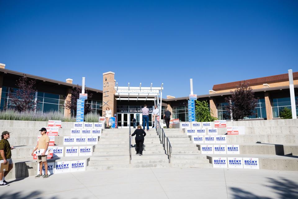 Signs supporting candidates are seen outside before the first 2nd Congressional District debate at Woods Cross High School in Woods Cross on Tuesday, June 20, 2023. | Ryan Sun, Deseret News