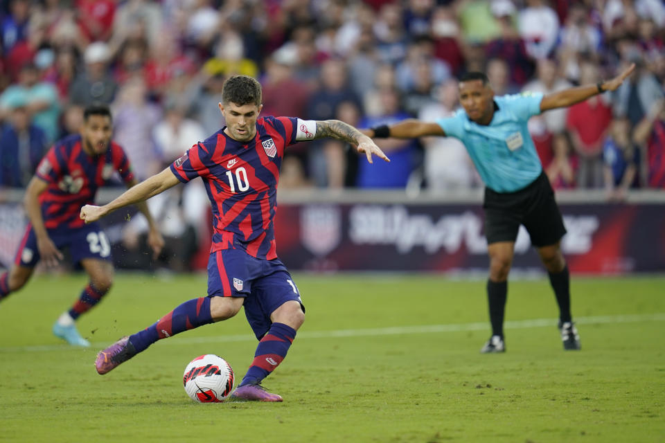 United States' Christian Pulisic (10) kicks a goal on a penalty kick against Panama during the first half of a FIFA World Cup qualifying soccer match, Sunday, March 27, 2022, in Orlando, Fla. (AP Photo/Julio Cortez)