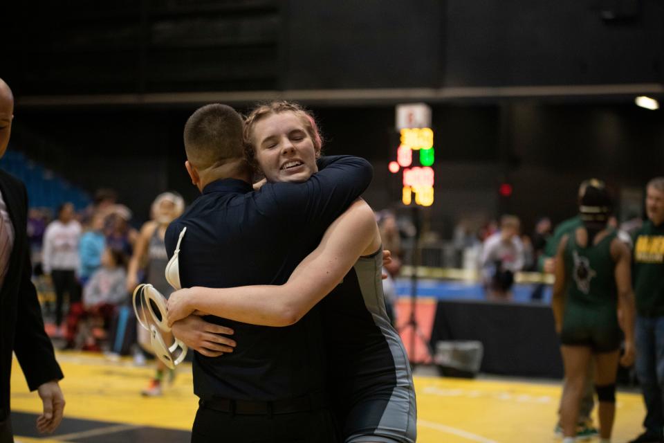 Washburn Rural's Madison Davison celebrates after advancing in the 6-5A girls state wrestling bracket on Thursday, Feb. 23, 2023.