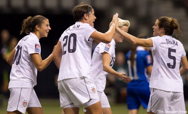 From left, Carli Lloyd, Abby Wambach, Megan Rapinoe and Kelley O'Hara celebrate Lloyd's goal against Guatemala.