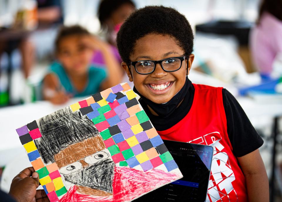 10-year-old D'Arius Taylor smiled while showing off the self-portrait he created during the Waterfront Park LVA Juneteenth camp on Friday, June 18, 2020