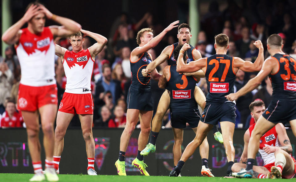 Toby Greene, pictured here celebrating with GWS players during their win over the Sydney Swans.