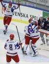 Russia's players Nikita Tryamkin (8), Andrei Mironov (L), Anton Slepyshev and goalie Andrei Vasilevski (30) celebrate their victory past Riley Barber of the U.S. (R) in their IIHF Ice Hockey World Championship quarter-final match in Malmo, Sweden, January 2, 2014. REUTERS/Alexander Demianchuk (SWEDEN - Tags: SPORT ICE HOCKEY)