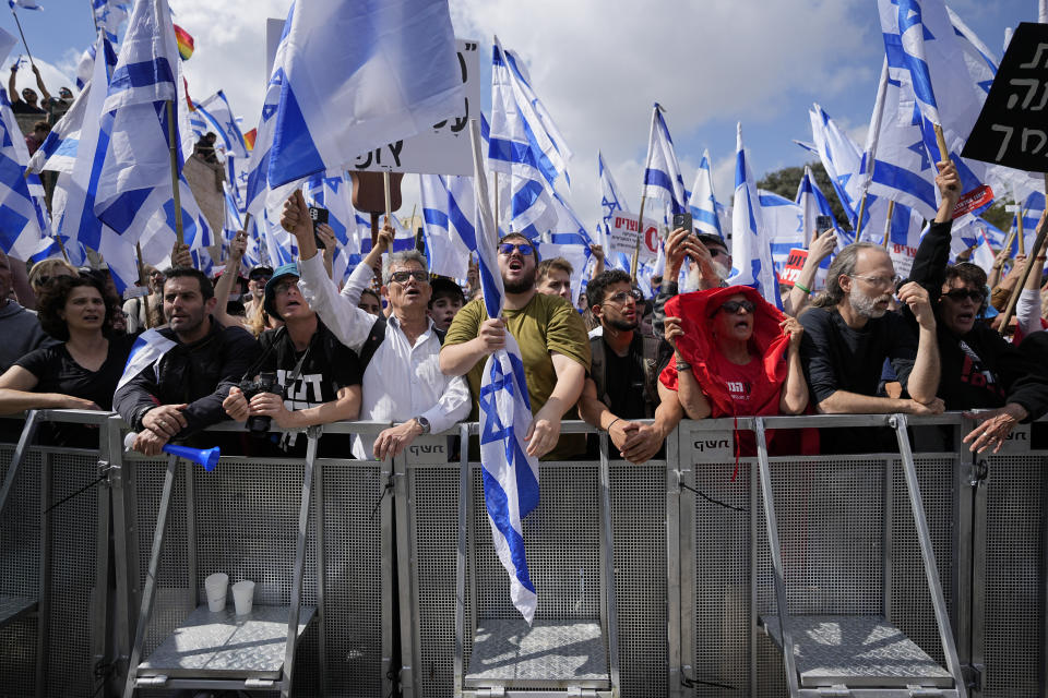 Israelis protest against Prime Minister Benjamin Netanyahu's judicial overhaul plan outside the parliament in Jerusalem, Monday, March 27, 2023. (AP Photo/Ohad Zwigenberg)