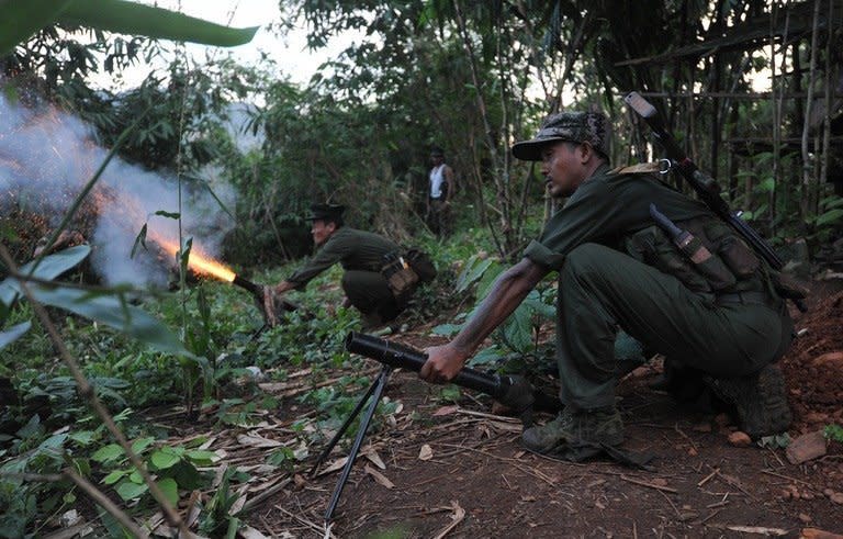 Kachin rebels fire rockets from an outpost on the Laja Yang frontline, on September 22, 2012. Kachin rebels cast doubt on Saturday over a Myanmar government pledge to end a military offensive after weeks of intense fighting that sparked international concern amid reports of fresh shelling