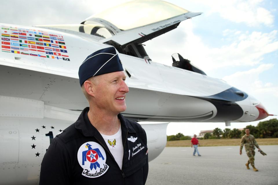 U.S. Air Force Lt. Col. Justin "Astro" Elliott stands alongside his Thunderbird 1 F-16 Fighting Falcon on Thursday at Patrick Space Force Base.