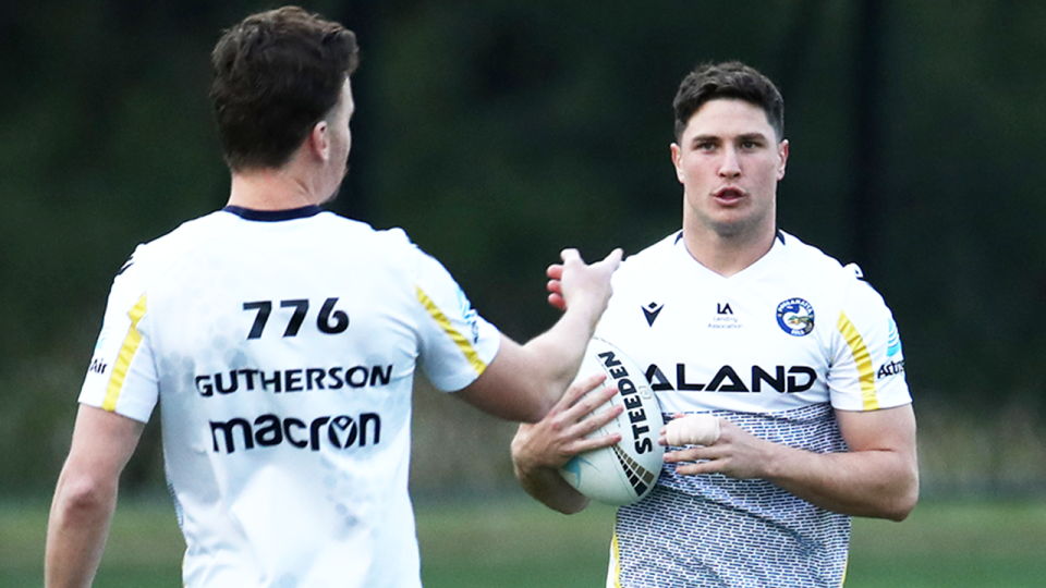 Clinton Gutherson (pictured left) speaks to Mitchell Moses (pictured right) during training.
