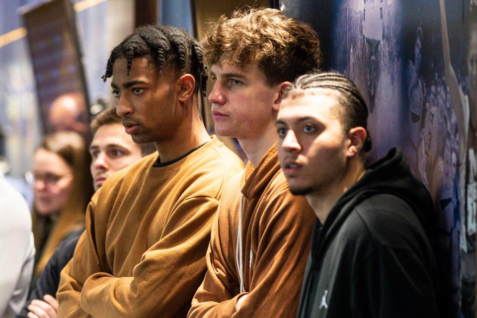 Michigan basketball team members include Jace Howard, Will Tschetter and George Washington III watch during introductory press conference for Dusty May at Junge Family Champions Center in Ann Arbor on Tuesday, March 26, 2024.