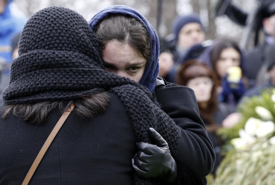 Zhanna, daughter of Russian leading opposition figure Boris Nemtsov, reacts during his funeral in Moscow