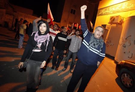 Zainab al-Khawaja (front L), daughter of human rights activist Abdulhadi al-Khawaja, and fellow human rights activist Nabeel Rajab (R) take part in a rally held in support of Abdulhadi al-Khawaja in the village of Bani-Jamra, west of Manama March 11, 2012. REUTERS/Hamad I Mohammed