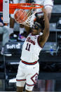 Illinois guard Ayo Dosunmu (11) dunks against Iowa in the second half of an NCAA college basketball game at the Big Ten Conference tournament in Indianapolis, Saturday, March 13, 2021. (AP Photo/Michael Conroy)