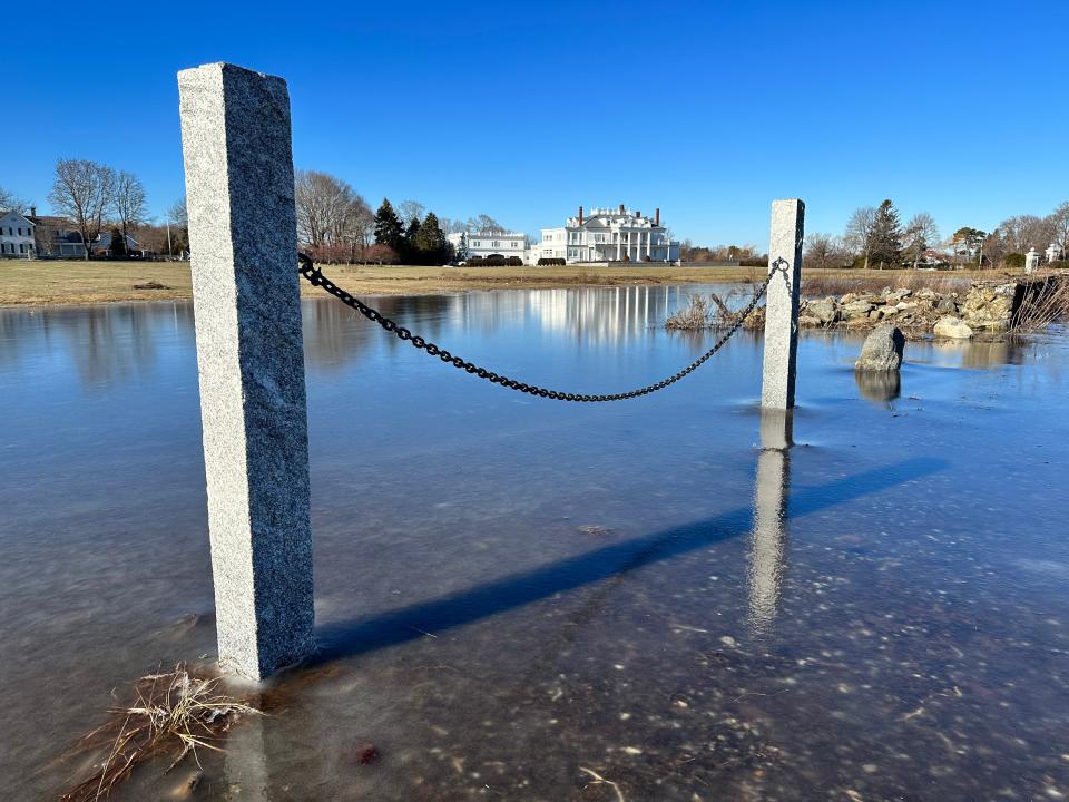 A view of a Rye home from the flooded roadside on Route 1A where portions of the road were still closed Monday, Jan. 15, 2024, following Saturday's storm.