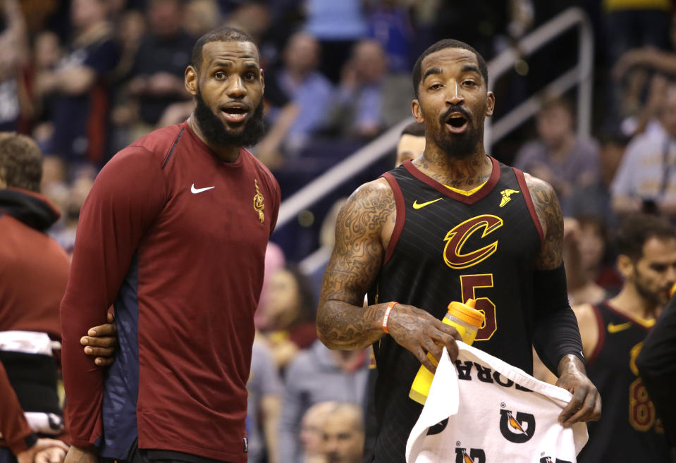 Cleveland Cavaliers forward LeBron James (23) and JR Smith (5) in the second half during an NBA basketball game against the Phoenix Suns, Tuesday, March 13, 2018, in Phoenix. The Cavaliers defeated the Suns 129-107. (AP Photo/Rick Scuteri)