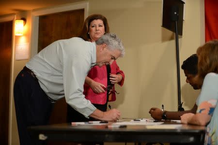 Republican candidate Karen Handel and her husband Steve Handel arrive to vote in Georgia's 6th Congressional District special election at St Mary's Orthodox Church, their polling place in Roswell, Georgia, U.S., June 20, 2017. REUTERS/Bita Honarvar