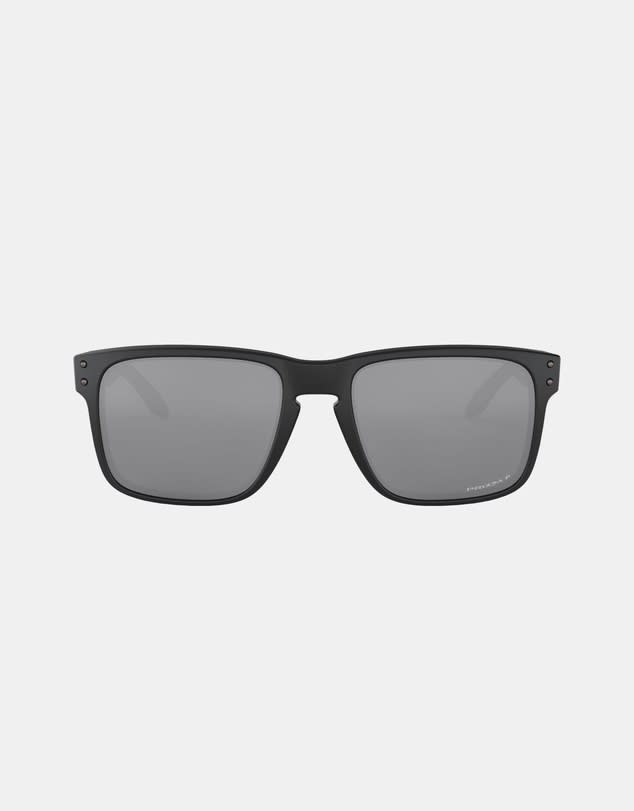 A pair of modern Oakley sunglasses in black on a grey background