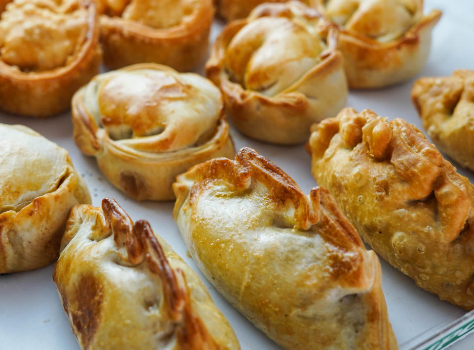 A selection of freshly baked assorted pastries on a tray