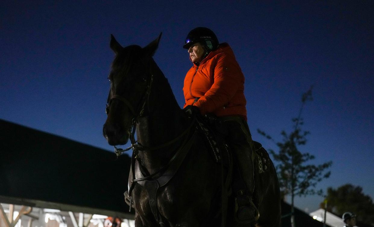 Pony rider Monnie Goetz waits to escort a horse to the track Tuesday morning at Churchill Downs May 2, 2023, in Louisville, Ky.