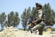 Iraqi government forces keep position in the Jurf al-Sakher area, some 50 kilometres south of Baghdad, to protect the area from further Islamic State group advancement, on May 24, 2015