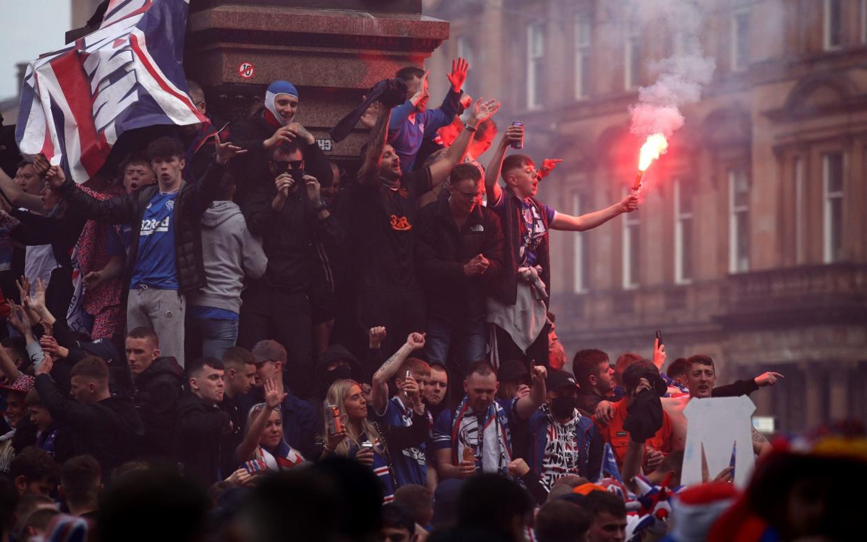 Rangers fans celebrate winning the Scottish Premiership in George Square, Glasgow - PA