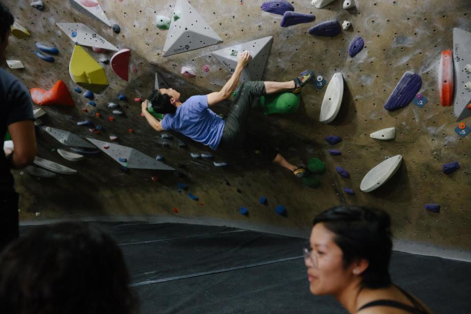 Calvin Wong rock climbs at a nearby gym to his home