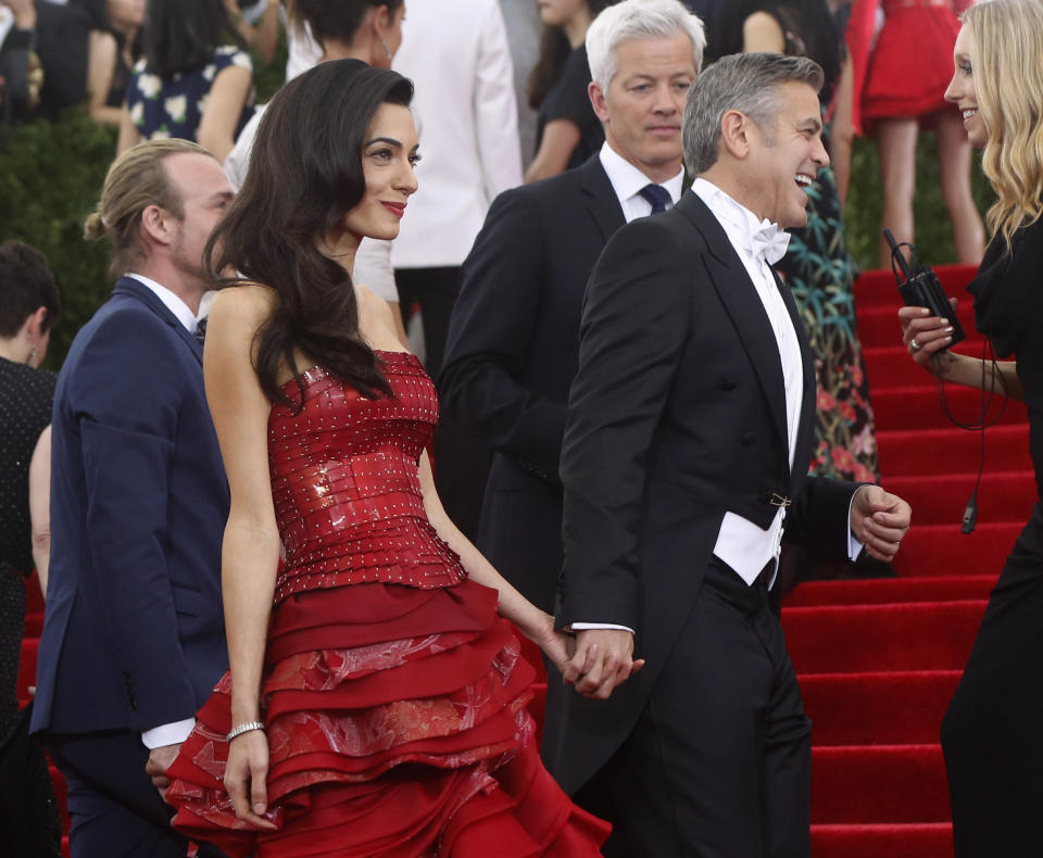 George Clooney and wife Amal Clooney arrive at the Metropolitan Museum of Art Costume Institute Gala 2015 celebrating the opening of "China: Through the Looking Glass," in Manhattan, New York May 4, 2015.&nbsp;