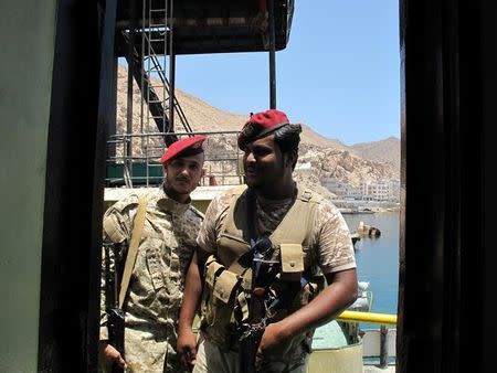 UAE-backed Yemeni soldiers stand guard on a boat in Mukalla port in southern Yemen April 22, 2017. Picture taken April 22, 2017. REUTERS/Aziz El Yaakoubi