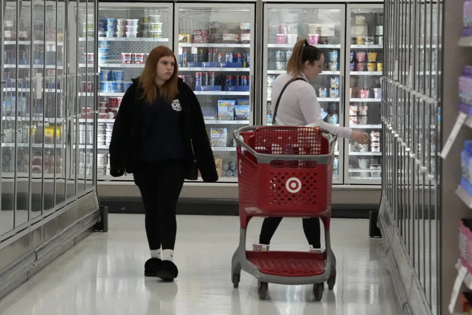 Shoppers check out the frozen food isle in a Target store in Pittsburgh on Monday, Jan. 23, 2023. On Tuesday, the Conference Board reports on U.S. consumer confidence for January. (AP Photo/Gene J. Puskar)