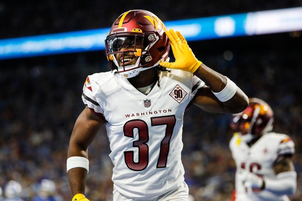 Sep 18, 2022; Detroit, Michigan, USA;  Washington Commanders cornerback Rachad Wildgoose (37) celebrates a touchdown scored by Commanders tight end Logan Thomas against the Detroit Lions during the second half at Ford Field.