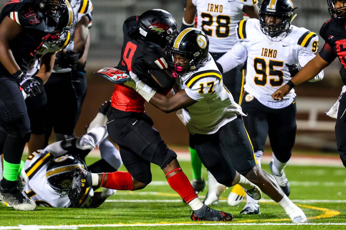 Irmo Yellowjackets Jylil Favor (17) brings down Westwood Redhawks Antwan Nelson (9) in their game at Westwood High School Friday, October 20, 2023.