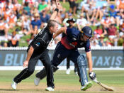 Cricket - ODI - New Zealand vs England - Seddon Park, Hamilton, New Zealand, February 25, 2018. England's Jos Buttler stretches to make his ground as New Zealand's Colin Munro appeals for a run out during their one-day international match. REUTERS/Ross Setford