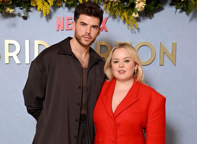 <p>Gareth Cattermole/Getty </p> Luke Newton and Nicola Coughlan attend the Season 3 screening of "Bridgerton" on February 14, 2024 in London, England.