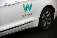 FILE PHOTO: A Waymo Chrysler Pacifica Hybrid self-driving vehicle is parked and displayed during a demonstration in Chandler, Arizona