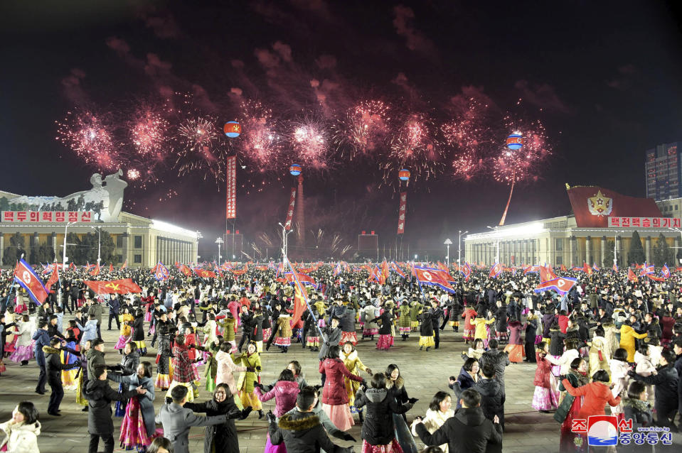 In this photo provided by the North Korean government, people dance in the celebration for the ruling party congress, at Kim Il Sung Square in Pyongyang, North Korea Thursday, Jan. 14, 2021. Independent journalists were not given access to cover the event depicted in this image distributed by the North Korean government. The content of this image is as provided and cannot be independently verified. Korean language watermark on image as provided by source reads: "KCNA" which is the abbreviation for Korean Central News Agency. (Korean Central News Agency/Korea News Service via AP)