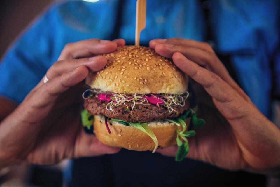 Man holding veggie burger