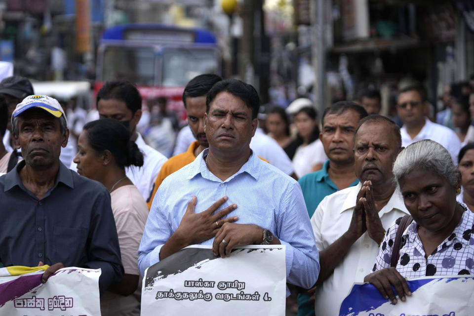 Sri Lankan Catholics with others take out a silent protest march to mark the fourth year commemoration of the 2019 Easter Sunday bomb attacks on Catholic Churches, in Colombo, Sri Lanka, Friday, April 21, 2023. Thousands of Sri Lankans held a protest in the capital on Friday, demanding justice for the victims of the 2019 Easter Sunday bomb attacks that killed nearly 270 people. (AP Photo/Eranga Jayawardena)