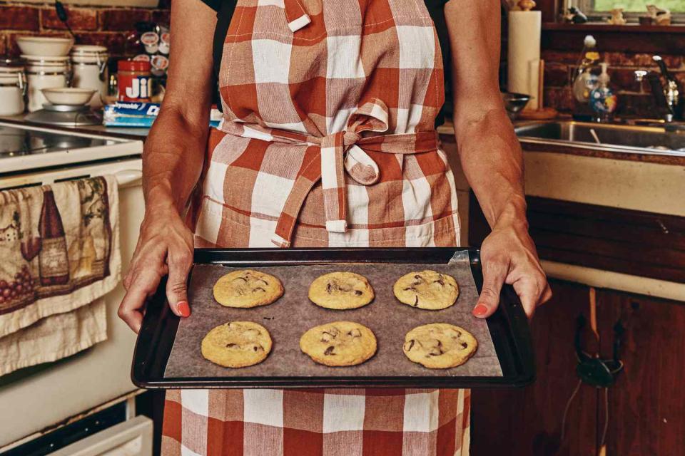 Tommie S. holds a tray of THC-infused chocolate chip cookies.