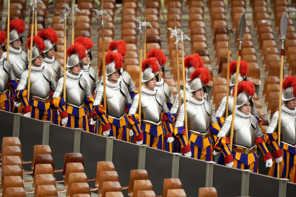 Vatican Swiss Guards arrive at the Pope Paul VI hall on the occasion of their swearing-in ceremony, at the Vatican, Friday, May 6, 2022. (AP Photo/Andrew Medichini)