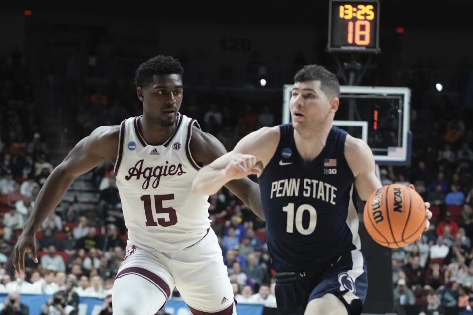 Penn State's Andrew Funk drives by Texas A&M's Henry Coleman III during the first half of a first-round college basketball game in the NCAA Tournament Thursday, March 16, 2023, in Des Moines, Iowa. (AP Photo/Morry Gash)