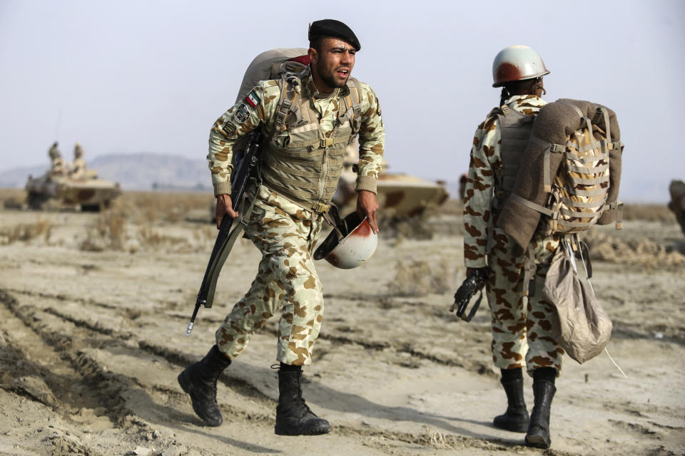 In this photo released on Tuesday, Jan. 19, 2021, by the Iranian Army, troops attend a military drill. Iran's military kicked off a ground forces drill on Tuesday along the coast of the Gulf of Oman, state TV reported, the latest in a series of snap exercises that the country is holding amid escalating tensions over its nuclear program and Washington's pressure campaign against Tehran. (Iranian Army via AP)