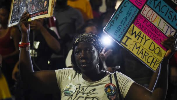 PHOTO: A woman joins demonstrators outside the St. Louis Justice Center following multiple arrests, Sept. 17, protesting the acquittal of former St. Louis police officer Jason Stockley, Sept. 18, 2017, in St. Louis, Mo.  (G-Jun Yam for ABC News)