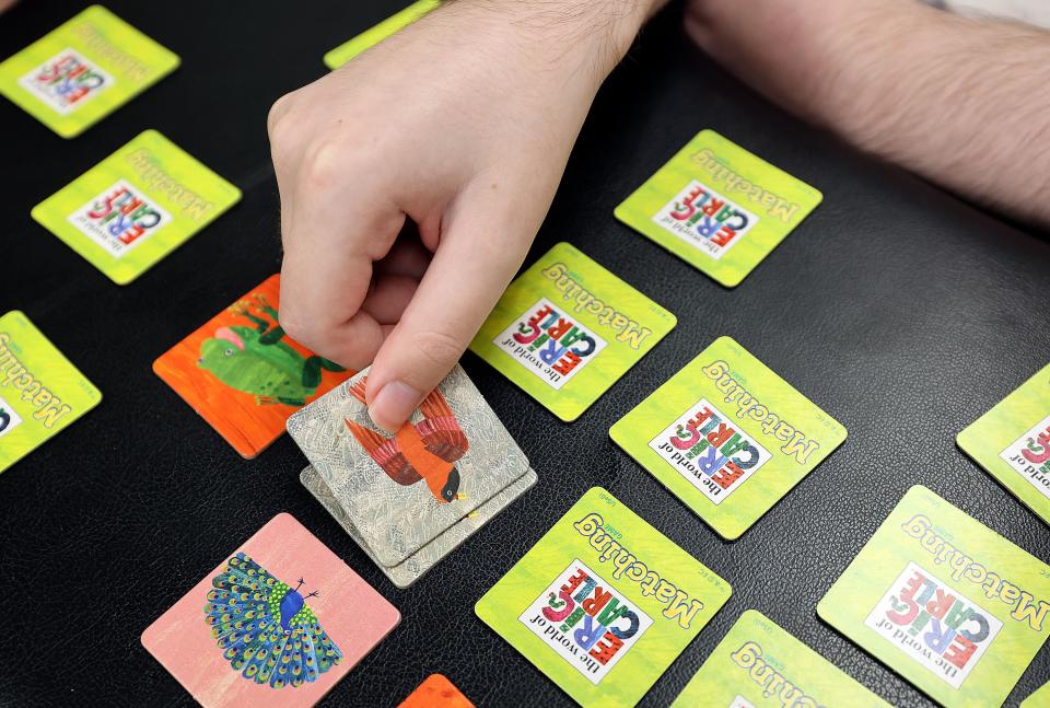 Stockton May, 21, plays a memory card game with his mother at the Utah State Developmental Center, where he lives, in American Fork on Monday, May 1, 2023. Stockton has Dravet syndrome, a severe form of epilepsy. | Kristin Murphy, Deseret News