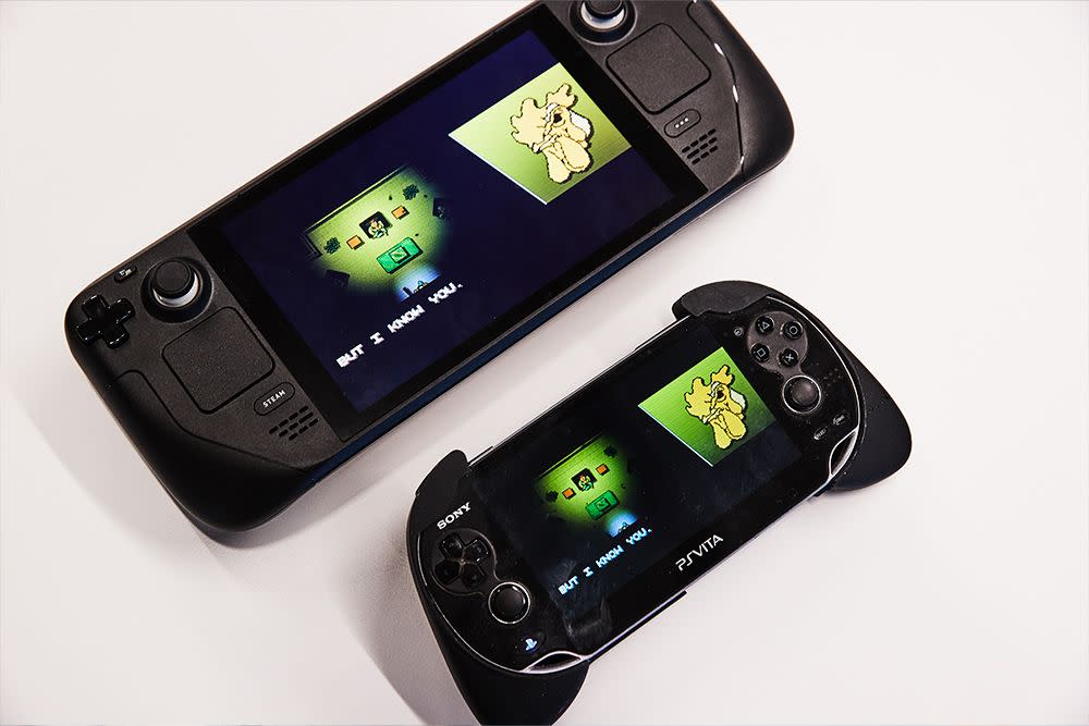 steam deck laying next to a ps vita
