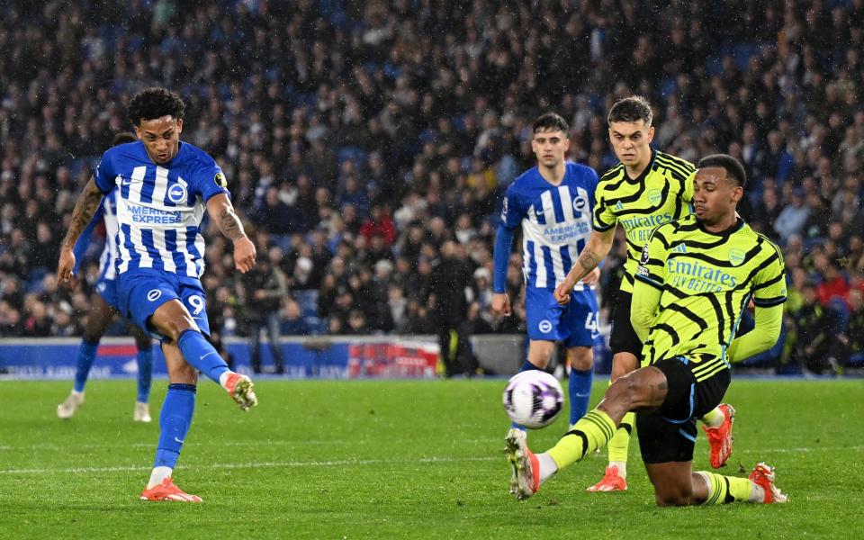 Joao Pedro's effort is blocked by Gabriel Magalhaes for Brighton